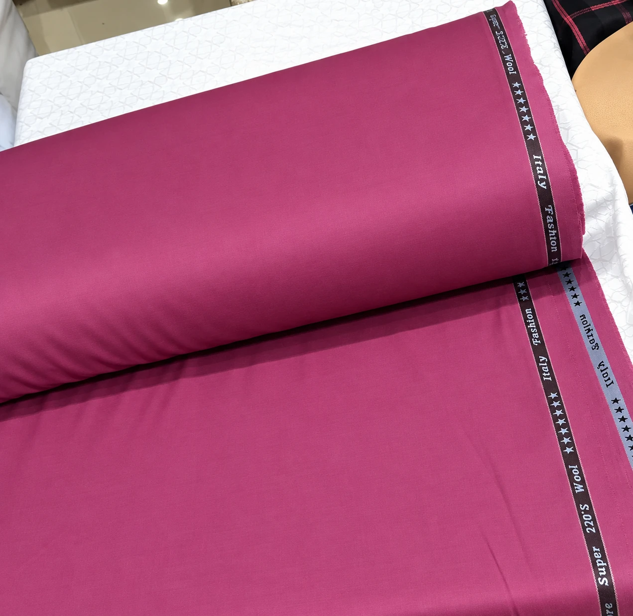 Rolled Kavali fabric showing its lustrous finish